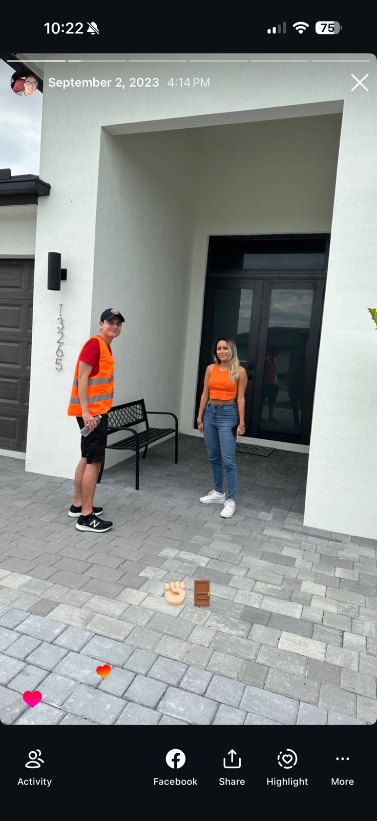 Two Glowhaus reps in branded gear at a home's front door, working door-to-door.