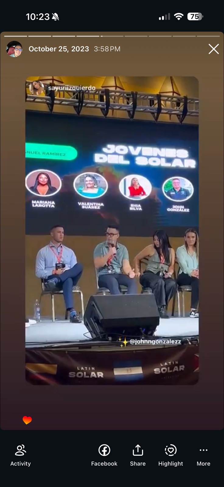 John Gonzalez on the Jovenes del Solar panel at the Latin Solar convention in Las Vegas, with his name and photo shown on the main stage screen.